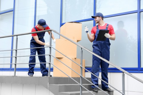 Furniture being carried from a flat during a Hounslow relocation