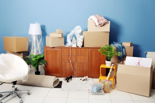 Crew securing furniture and checking access during a move