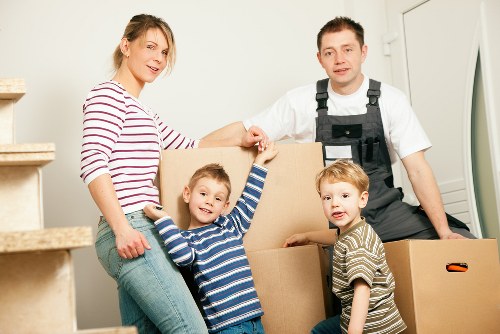 Careful loading of household items into a removal van in Hounslow
