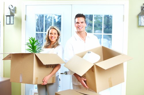 Packed office boxes and furniture ready for transport